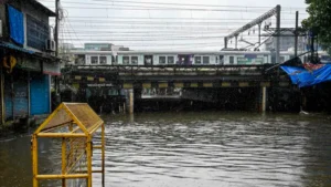 Mumbai rains LIVE Updates: A metro passes over the Andheri subway in Mumbai which was closed for commuters due to waterlogging amid heavy rainfall on Monday, July 8. (PTI)